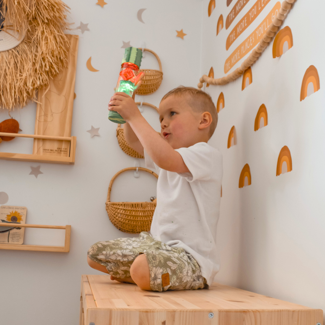 Boy holding calm down bottle