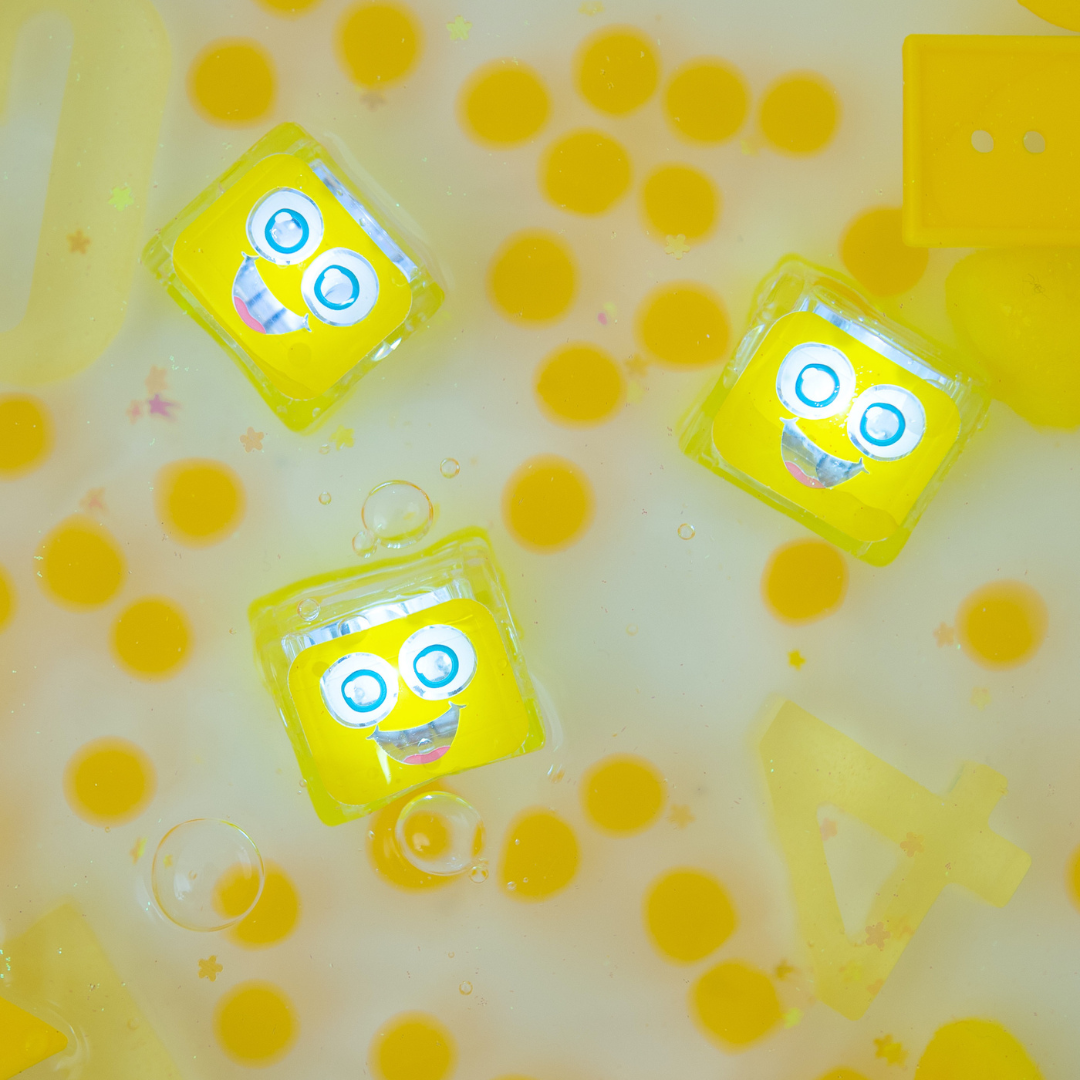 Yellow light up cubes in water