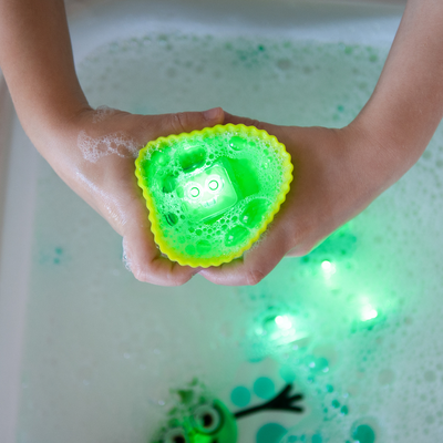 Green light up cubes in water