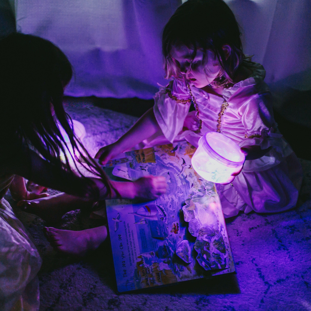 Girls playing with light up jar