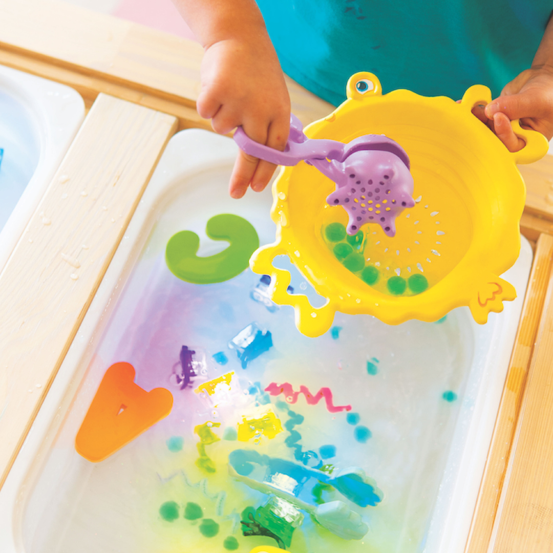 Close up of kids playing with sensory toys