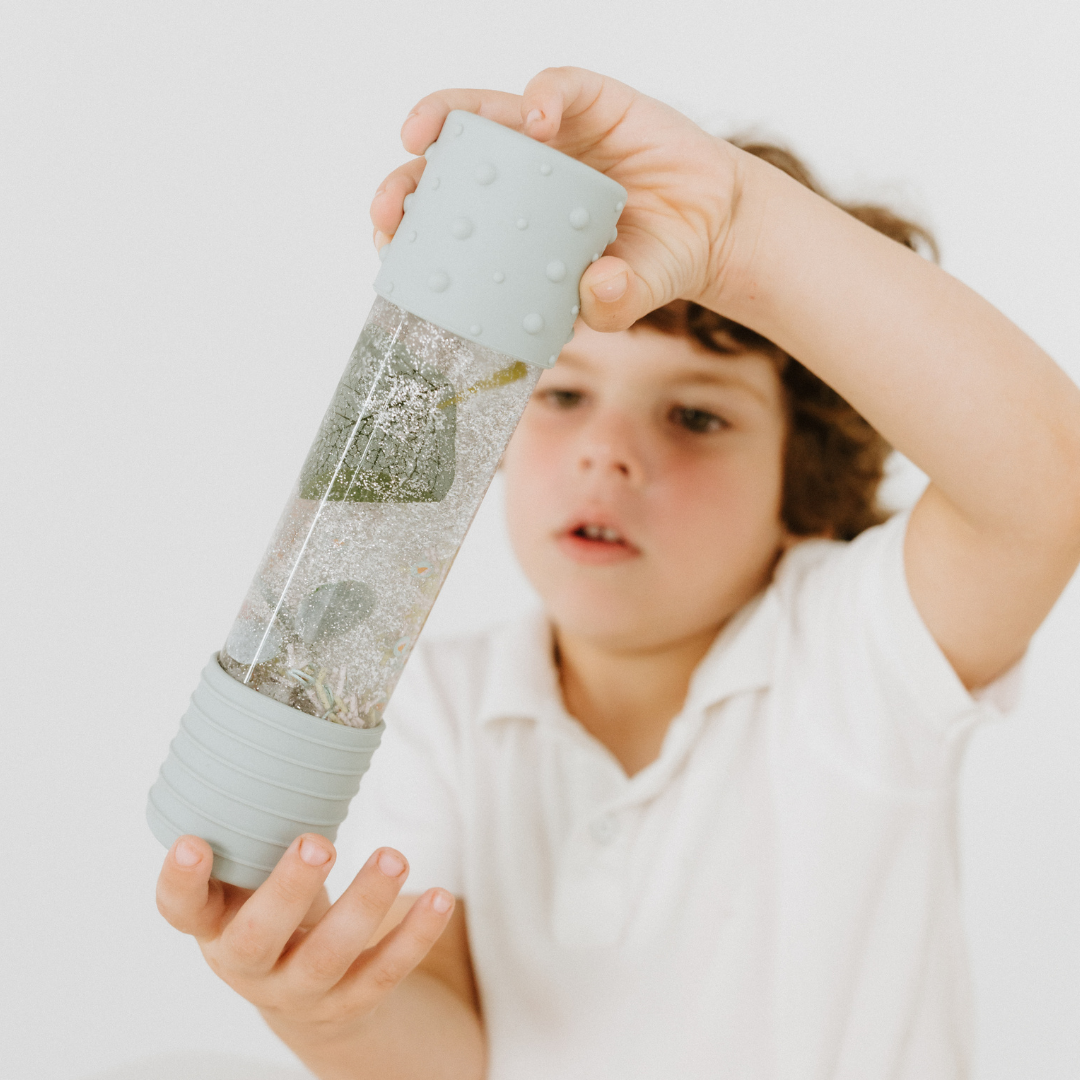 Boy playing with May Gibbs calm down bottle