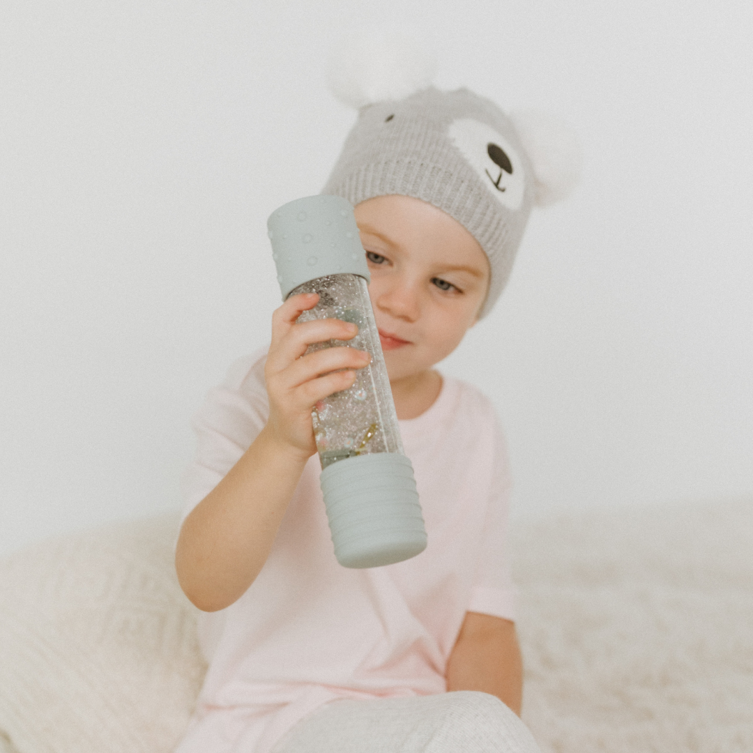 Girl playing with May Gibbs calm down bottle