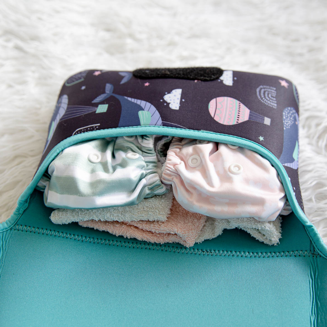 Baby change mat with cloth nappies inside