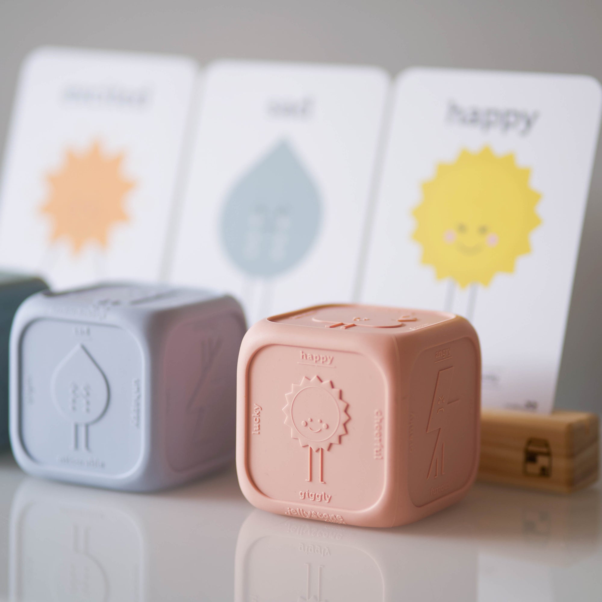 Feelings Cube on a table with cards