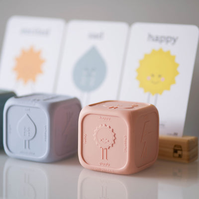 Feelings Cube on a table with cards