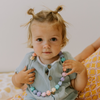 Baby girl wearing a necklace