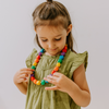 Girl wearing rainbow necklace