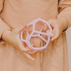 Girl holding bubblegum sensory ball