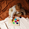 Boy playing with wood colour sorter