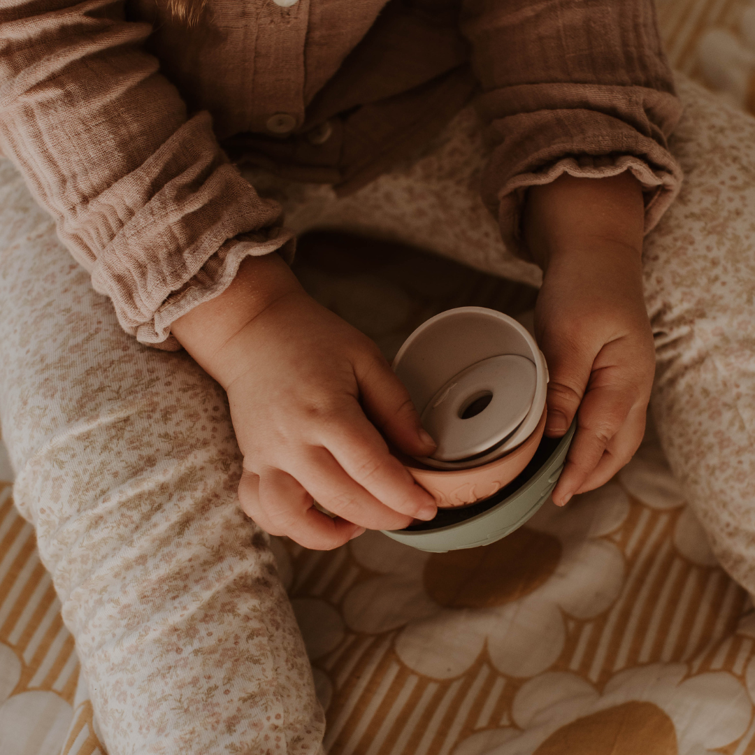 Close up of girl holding silicone cups